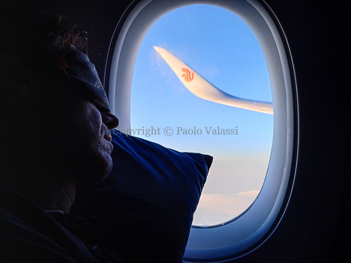 Airport - In flight to Shanghai sleeping